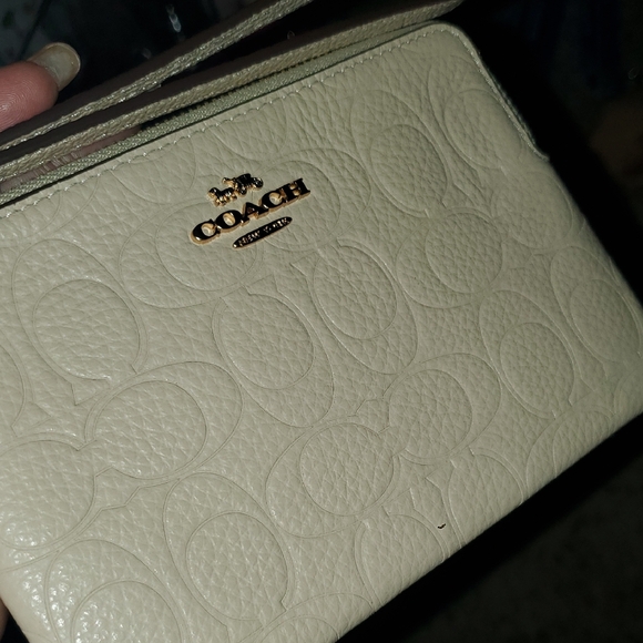 Coach Embossed Cream Wristlet - Picture 1 of 5